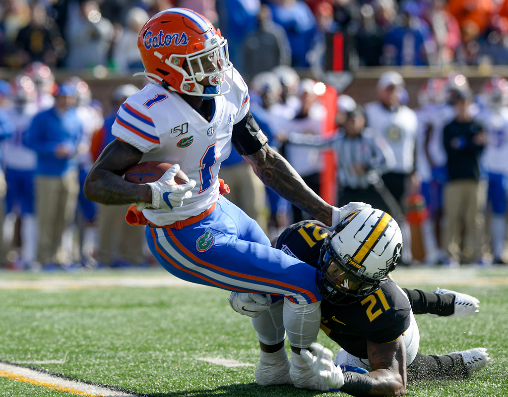Florida running back Kadarius Toney is brought to the ground by Missouri defensive back Christian Holmes
